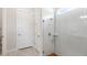 Shower with stylish tile, glass doors, and modern fixtures and an adjacent doorway at 15049 Canopy Cover Dr, Winter Garden, FL 34787