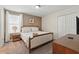 Comfortable bedroom featuring a queen bed and a neutral color palette at 1520 Mulligan Blvd, Davenport, FL 33896