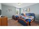 Nicely decorated bedroom with two twin beds and unique decor at 1520 Mulligan Blvd, Davenport, FL 33896