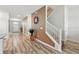 Inviting entryway with tiled floors and a staircase with white railings at 1520 Mulligan Blvd, Davenport, FL 33896