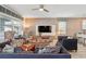 Bright living room with stylish decor, featuring comfortable furniture and wall-mounted TV at 1520 Mulligan Blvd, Davenport, FL 33896
