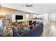 Open-concept living room with modern decor and seamless flow to the kitchen at 1520 Mulligan Blvd, Davenport, FL 33896