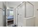 Clean shower featuring seamless glass door and a view of the bedroom at 1520 Mulligan Blvd, Davenport, FL 33896