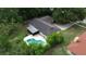 Charming home featuring a private backyard oasis with a sparkling pool and screened-in lanai at 1525 Jaguar Cir, Apopka, FL 32712