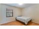 Bright bedroom with laminate floors and a sunny window view at 1525 Jaguar Cir, Apopka, FL 32712