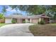 Charming single-story home with a two-car garage and well-maintained front yard at 1525 Jaguar Cir, Apopka, FL 32712