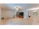 Spacious living room with tile flooring and access to multiple rooms, featuring a TV at 1525 Jaguar Cir, Apopka, FL 32712
