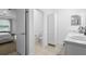 Bathroom with a double vanity and a connecting door to a separate toilet room at 15356 White Tail Loop, Mascotte, FL 34753