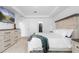 Bedroom featuring a bed, dresser, and a glimpse into an adjacent walk-in closet at 15356 White Tail Loop, Mascotte, FL 34753