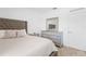 A bedroom featuring a comfortable bed, dresser, and stylish decor, perfect for relaxation and rest at 15356 White Tail Loop, Mascotte, FL 34753