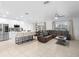Open-concept living area with a modern kitchen, dining area, and comfortable seating at 15356 White Tail Loop, Mascotte, FL 34753
