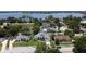 Stunning aerial view of lakeside homes in a quiet neighborhood with mature trees and lush green lawns at 1676 Bear Crossing Cir, Apopka, FL 32703