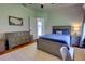 Inviting bedroom featuring a dresser, comfortable bed with baseball pillow, and a study desk, creating a cozy retreat at 1676 Bear Crossing Cir, Apopka, FL 32703