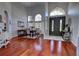 Elegant dining room featuring hardwood floors, high ceilings, chandelier, and large windows at 1676 Bear Crossing Cir, Apopka, FL 32703