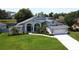 Beautiful single-story home boasts a manicured lawn and well-maintained landscaping at 1676 Bear Crossing Cir, Apopka, FL 32703
