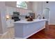 Spacious kitchen features a large island, modern appliances, ample cabinet space, and stylish finishes for cooking at 1676 Bear Crossing Cir, Apopka, FL 32703
