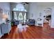 Comfortable living room features hardwood floors and high ceilings with a large window at 1676 Bear Crossing Cir, Apopka, FL 32703