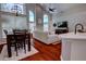 Inviting living room features wood floors, high ceilings, lots of natural light, and an open-concept layout at 1676 Bear Crossing Cir, Apopka, FL 32703