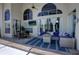 Inviting covered patio with a dining table and lounge area, creating an ideal outdoor space at 1676 Bear Crossing Cir, Apopka, FL 32703