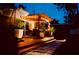 Backyard wooden deck with patio furniture and string lights under a twilight sky at 1919 E South St, Orlando, FL 32801