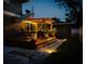 Backyard patio with deck, pergola, outdoor lighting, and pavers at 1919 E South St, Orlando, FL 32801