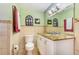 Bathroom featuring a granite countertop, updated fixtures, and decorative mirrors in neutral color palette at 1919 E South St, Orlando, FL 32801