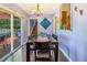 Charming dining room with wood floors, pendant lighting, and access to the outdoor patio at 1919 E South St, Orlando, FL 32801