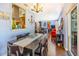 Inviting dining room with hardwood floors, modern table, and view into the living room providing an open feel at 1919 E South St, Orlando, FL 32801