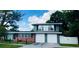 Charming two-story home featuring a brick and gray facade with a two-car garage and well-manicured lawn at 1919 E South St, Orlando, FL 32801