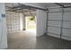 Spacious one-car garage with cinder block walls, garage door opener, and concrete floors at 1919 E South St, Orlando, FL 32801