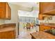 Bright kitchen with granite countertops, stainless steel appliances, and an adjacent dining area at 1919 E South St, Orlando, FL 32801