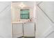 Laundry room featuring a full-size white washer and dryer, a window and white walls at 1919 E South St, Orlando, FL 32801