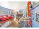 Bright living room featuring stylish sofas, hardwood floors, and an open concept to the dining area at 1919 E South St, Orlando, FL 32801