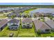 Aerial view showcases a beautiful home with a fenced yard in a lakeside community at 200 Azure Mist Way, Daytona Beach, FL 32124