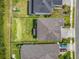 Aerial view showcases a home with a backyard, fence, and a play set at 200 Azure Mist Way, Daytona Beach, FL 32124