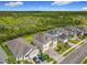 Aerial view of a landscaped home near a large nature preserve at 200 Azure Mist Way, Daytona Beach, FL 32124