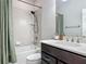 Clean bathroom featuring a tub-shower combo with white tile and modern fixtures at 200 Azure Mist Way, Daytona Beach, FL 32124