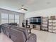 Comfortable living room with neutral paint, tile floors, and a large window for natural light at 200 Azure Mist Way, Daytona Beach, FL 32124
