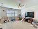Spacious playroom with a ceiling fan, neutral carpet, and several play structures at 200 Azure Mist Way, Daytona Beach, FL 32124