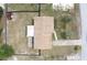 Aerial view of home on a large lot, featuring a long driveway and fenced yard at 2013 Dearing Ave, Deltona, FL 32725