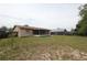 Large, fenced backyard with patio attached to home at 2013 Dearing Ave, Deltona, FL 32725