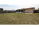 Spacious backyard featuring the home's patio and fenced yard at 2013 Dearing Ave, Deltona, FL 32725