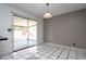 Dining room featuring tiled floors, sliding glass doors to the porch, and a pendant light fixture at 2013 Dearing Ave, Deltona, FL 32725