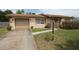 Charming single-Gathering home featuring a driveway, a well-kept lawn, and a cozy front porch at 2013 Dearing Ave, Deltona, FL 32725