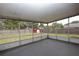Screened patio featuring a view of the spacious fenced backyard and shed at 2013 Dearing Ave, Deltona, FL 32725