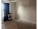 This bedroom features carpet flooring, neutral paint and a large window at 268 Fiddlewood Ct, Davenport, FL 33837