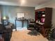 Bedroom featuring neutral-toned walls, a desk, an office chair and cabinet at 268 Fiddlewood Ct, Davenport, FL 33837