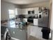 Bright kitchen with stainless steel appliances and a kitchen island at 268 Fiddlewood Ct, Davenport, FL 33837