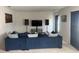 Bright living room featuring a comfortable couch, speakers and TV at 268 Fiddlewood Ct, Davenport, FL 33837