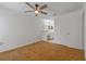 Bright bedroom with ceiling fan and en-suite bathroom, creating a relaxing retreat at 2750 King Oak Cir, St Cloud, FL 34769
